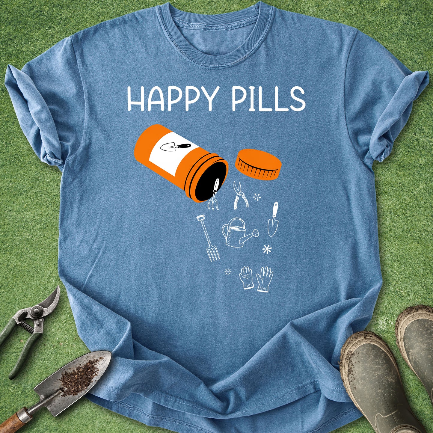 Blue t-shirt with 'Happy Pills' graphic on a grassy background