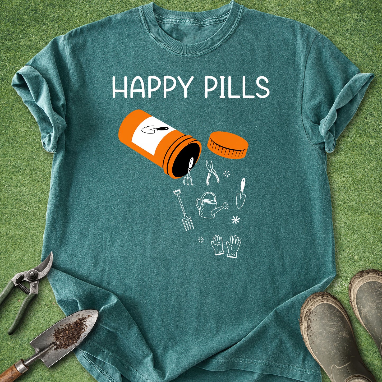 Teal t-shirt with 'Happy Pills' graphic on a grass background