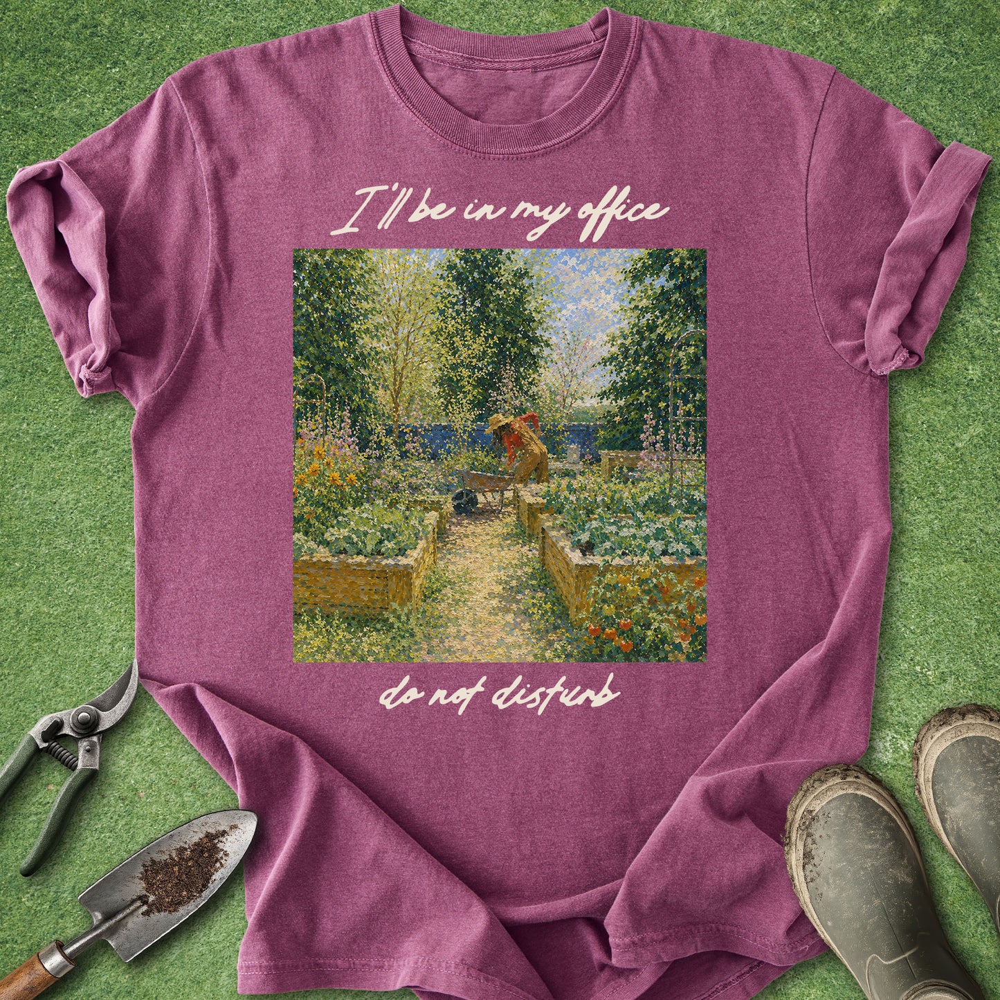 Purple t-shirt with garden scene and text on a grass background