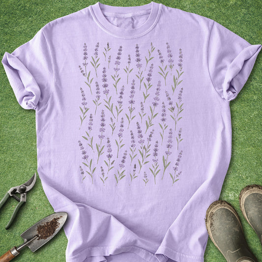 Purple t-shirt with lavender design on a green background