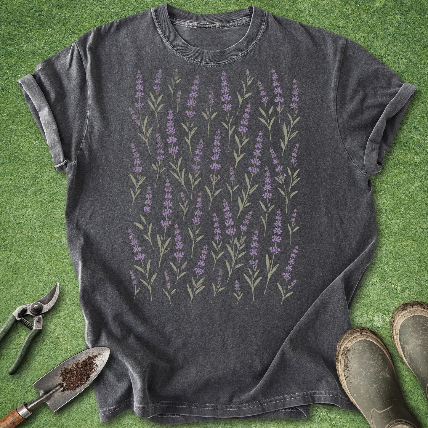 Dark gray t-shirt with lavender design on a green grass background