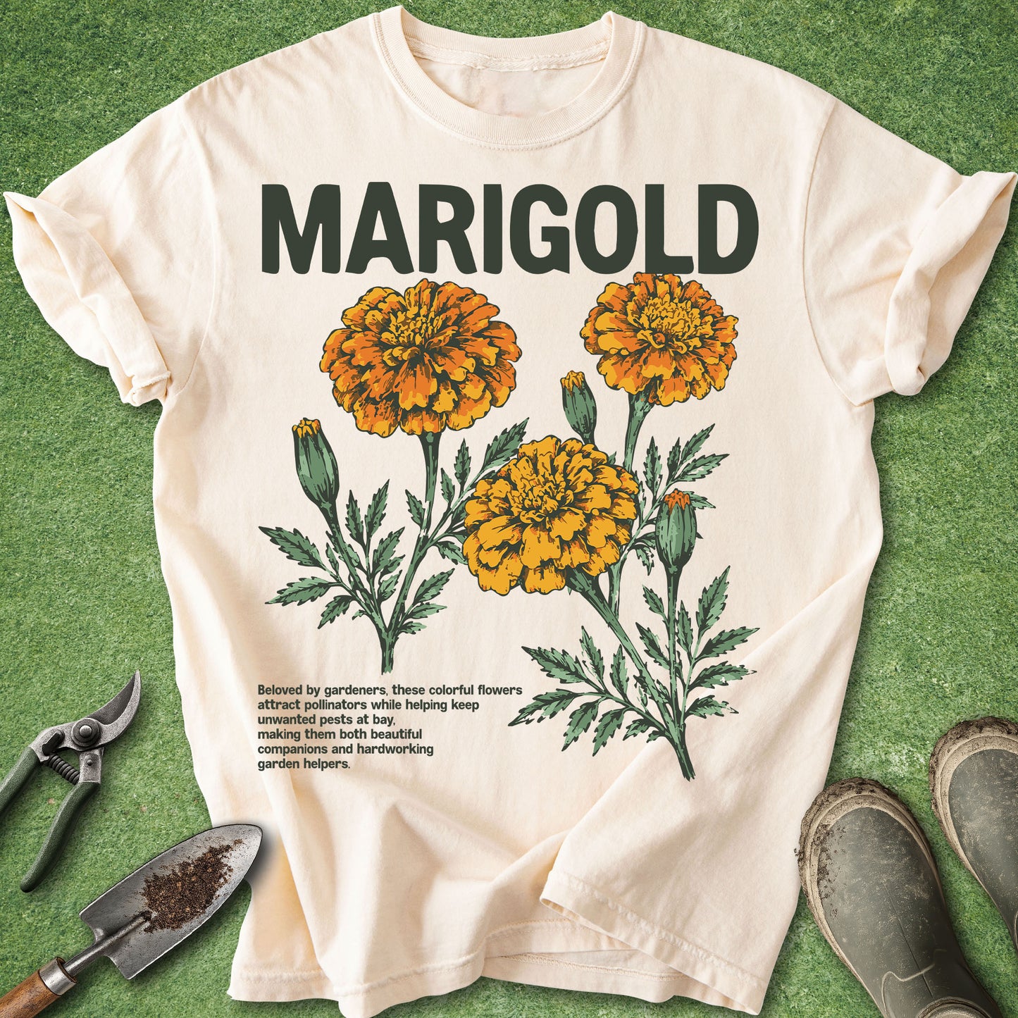 Beige t-shirt with marigold flower design and text on a green background