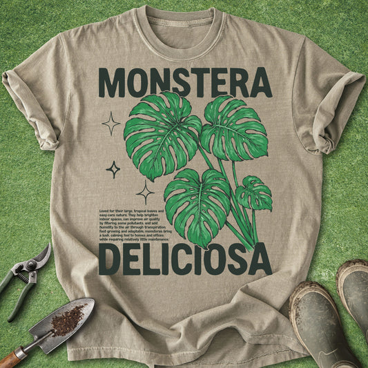 Beige t-shirt with green monstera deliciosa leaves and text on a green background