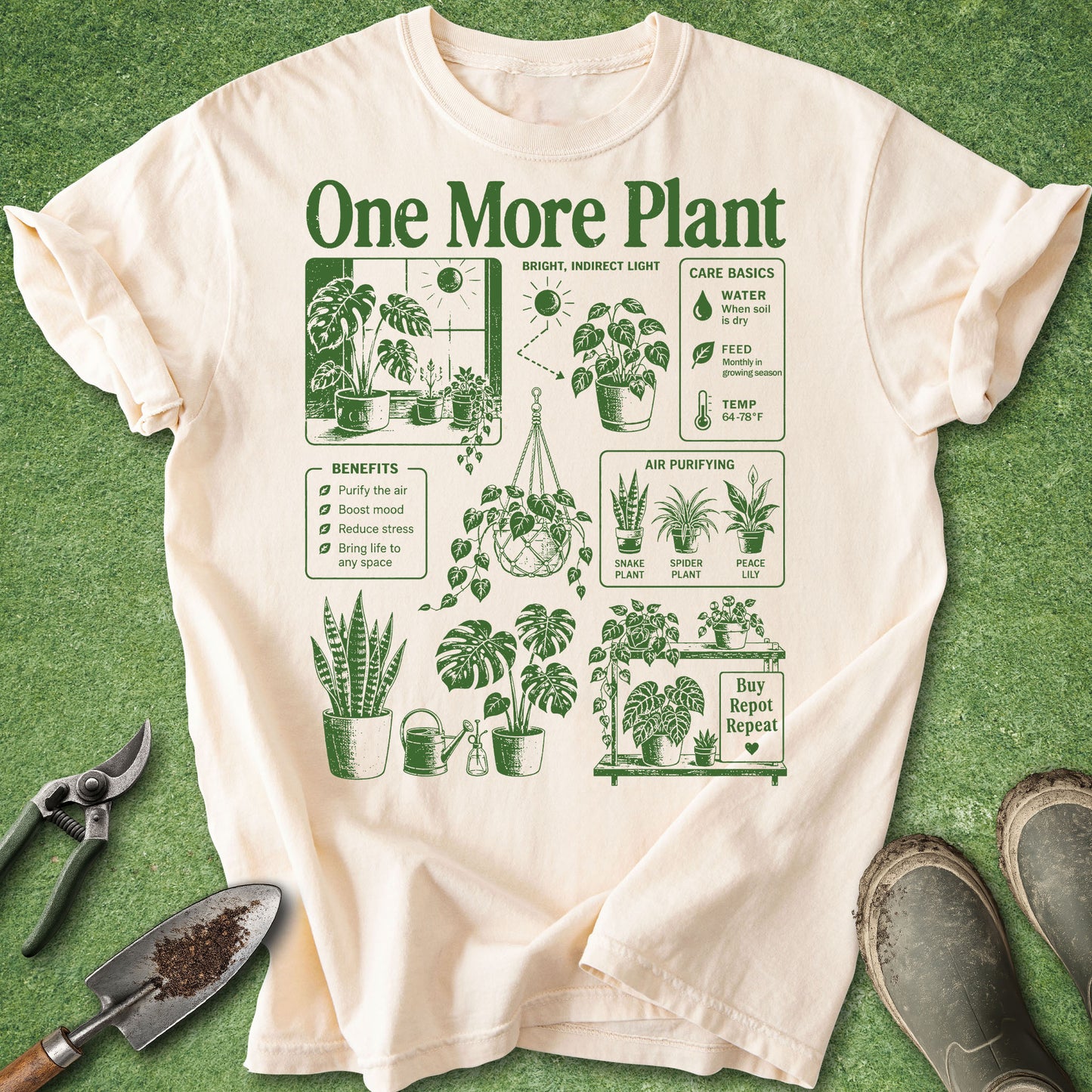 Ivory t-shirt with “One More Plant” text and green vintage-style houseplant illustrations featuring monstera, snake plant, hanging plants and plant care graphics.