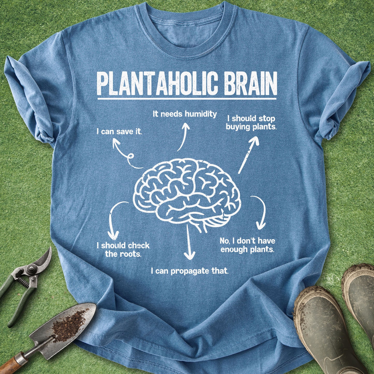 Blue t-shirt with a brain graphic and text on a grass background