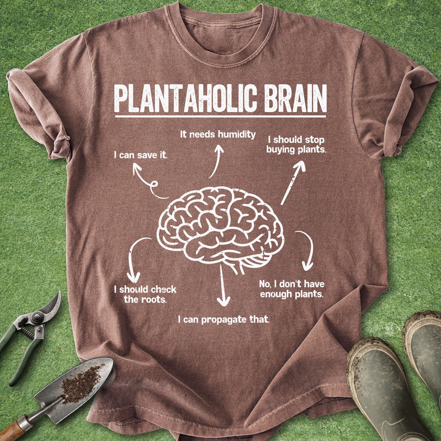 Brown t-shirt with a graphic of a brain and text on a green grass background