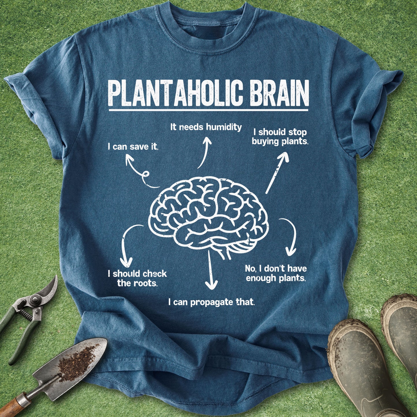 Blue t-shirt with a brain graphic and text on a grass background
