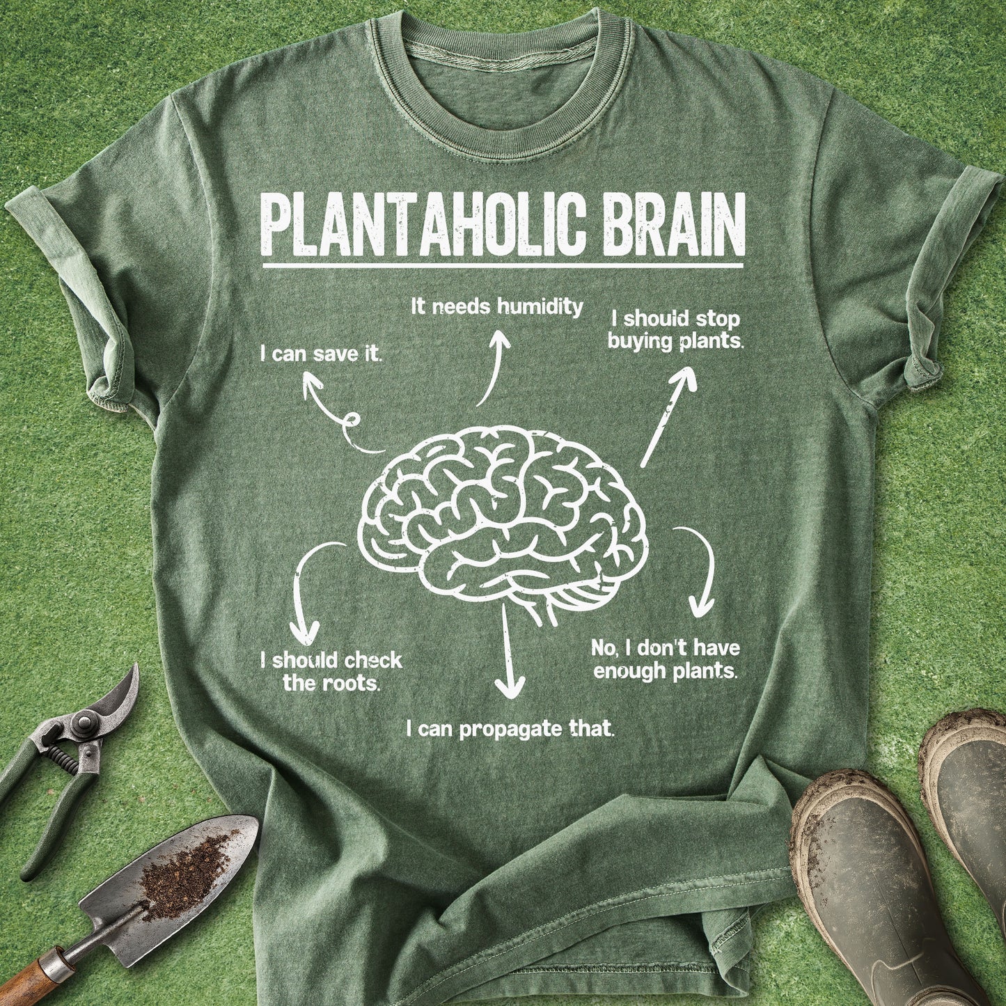 Green t-shirt with a brain graphic and text on a grass background