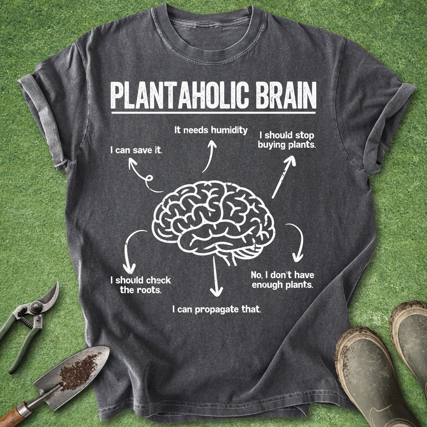 Gray t-shirt with a brain graphic and text on a green grass background