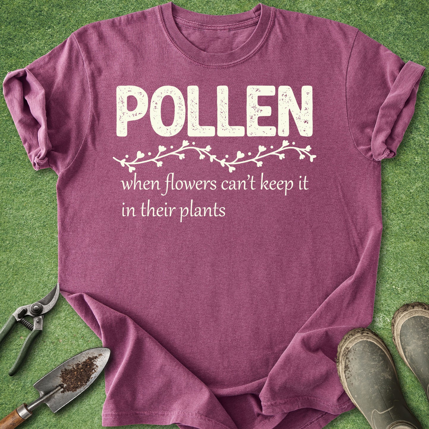 Purple t-shirt with 'Pollen' text on a grass background