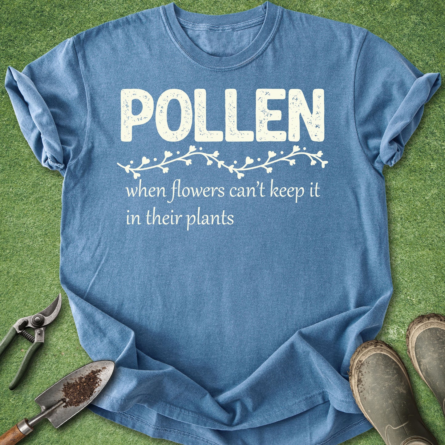 Blue t-shirt with 'Pollen' text on a green background