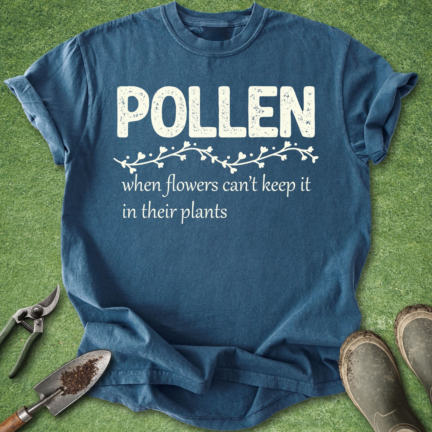 Blue t-shirt with 'Pollen' text on a grass background