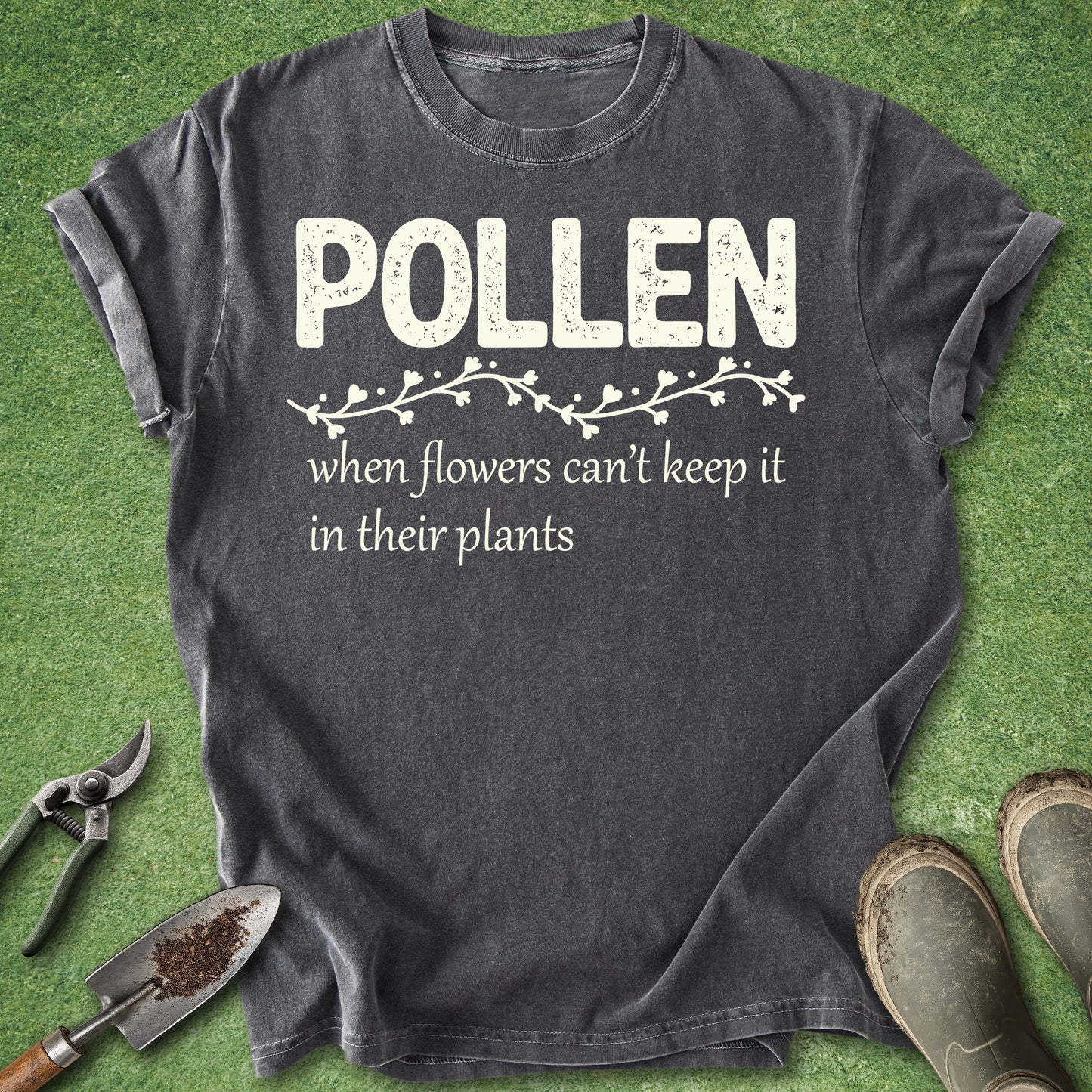 Gray t-shirt with 'Pollen' text on a green grass background