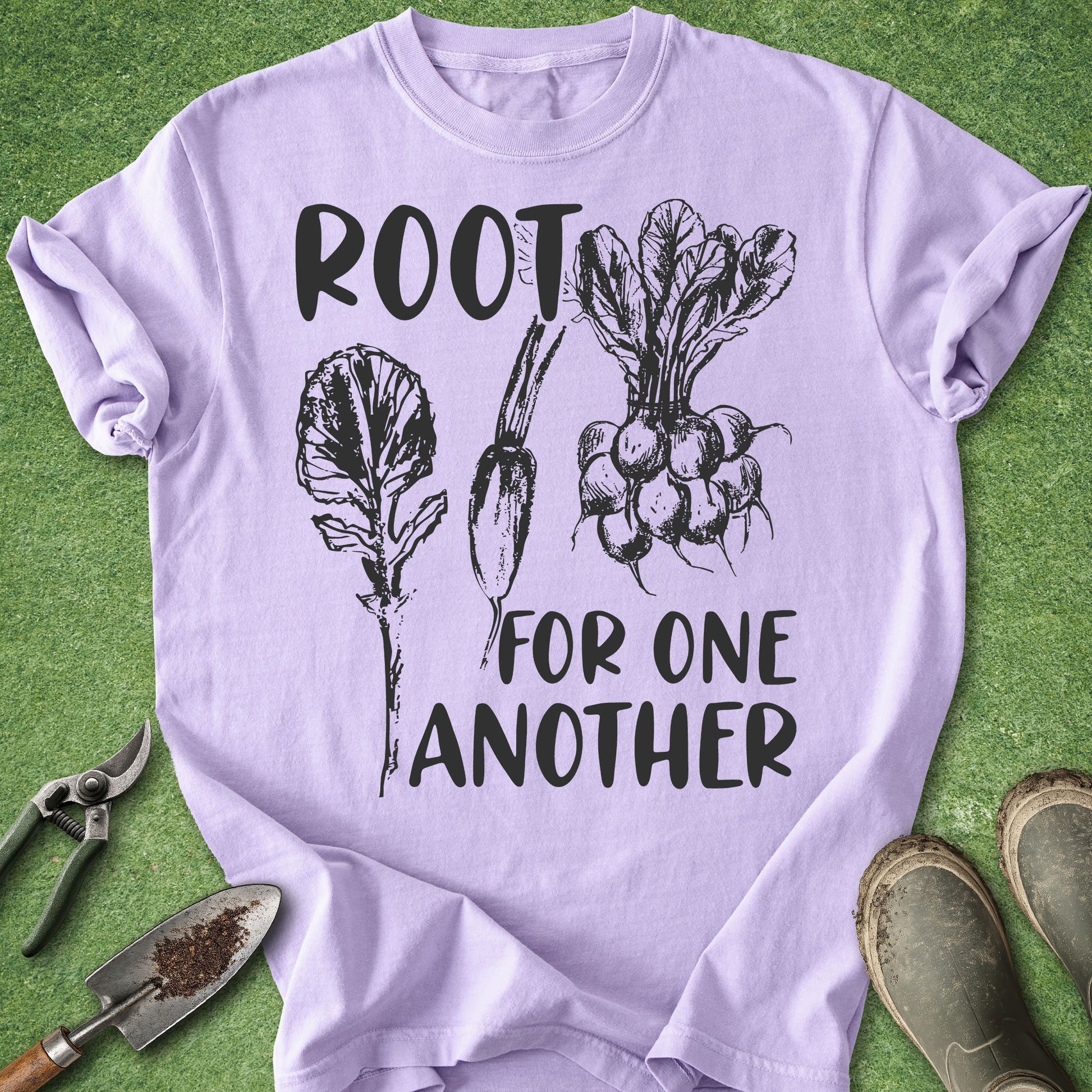 Comfort Colors orchid t-shirt featuring the phrase "Root for One Another" with vintage-style illustrations of leafy root vegetables including radishes and beets in black ink.
