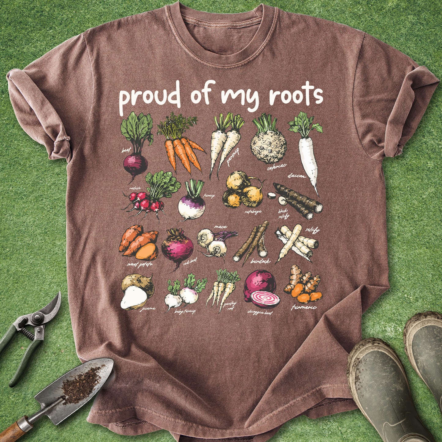 Brown t-shirt with vegetable illustrations and 'proud of my roots' text on a green background