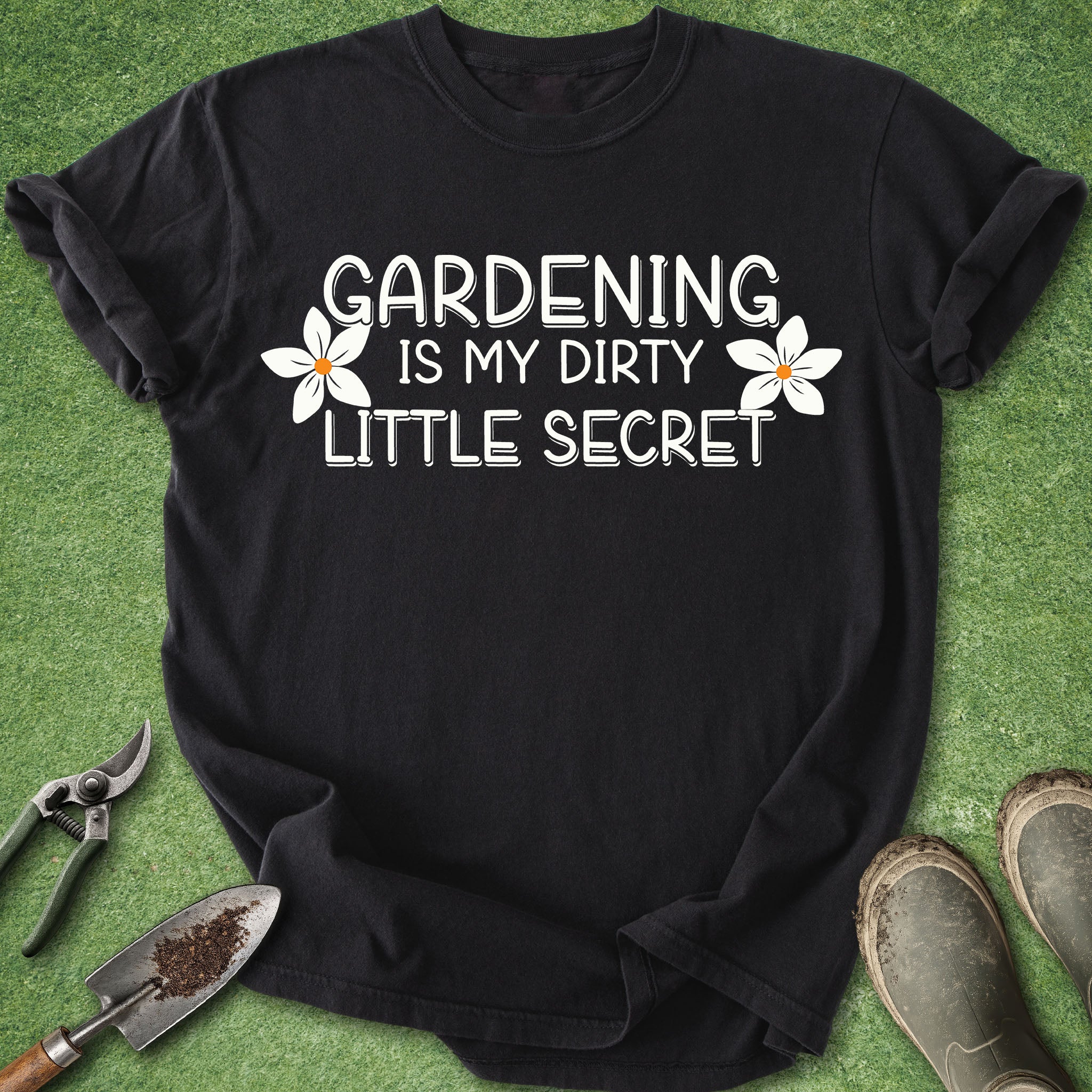 Black t-shirt with 'Gardening is my dirty little secret' text on a green background with gardening tools and boots.