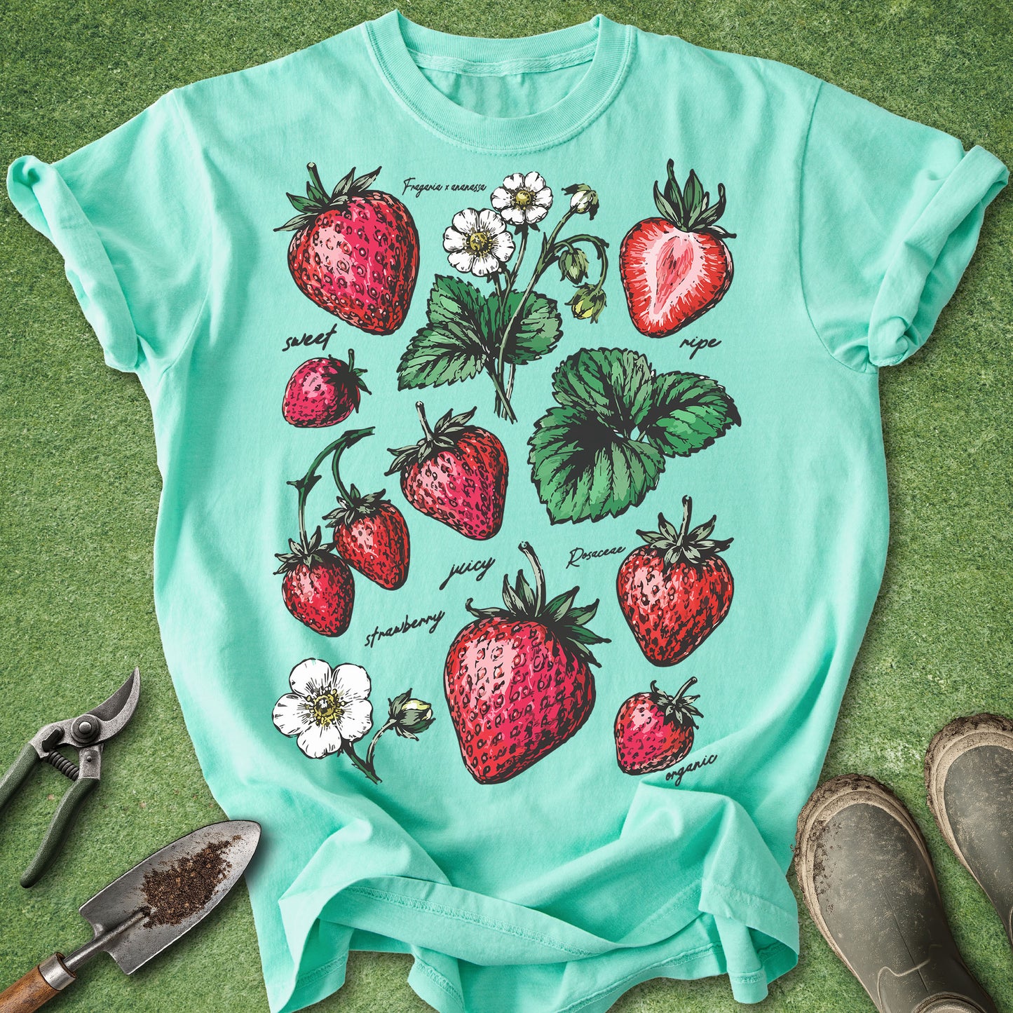 Island Reef Comfort Colors t-shirt featuring vintage botanical illustrations of strawberries, strawberry blossoms, and leaves in vibrant red and green colors, perfect for gardeners and berry lovers.