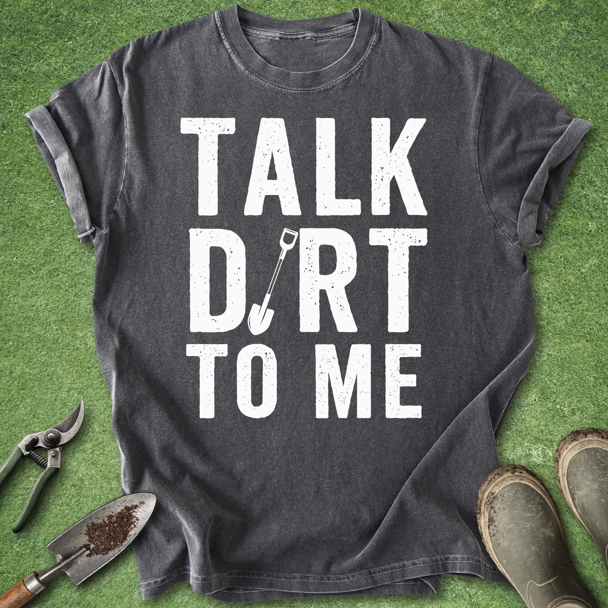 Dark gray t-shirt with bold “Talk Dirt to Me” text and small shovel graphic