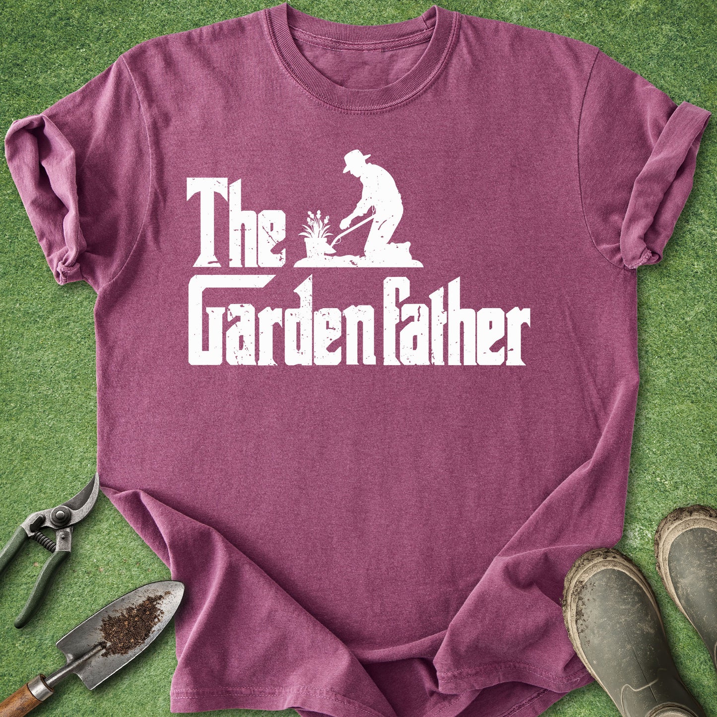 Purple t-shirt with 'The Garden Father' design on a grass background