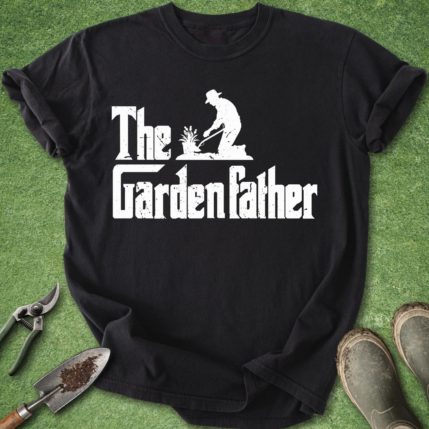 Black t-shirt with 'The Garden Father' design on a green grass background