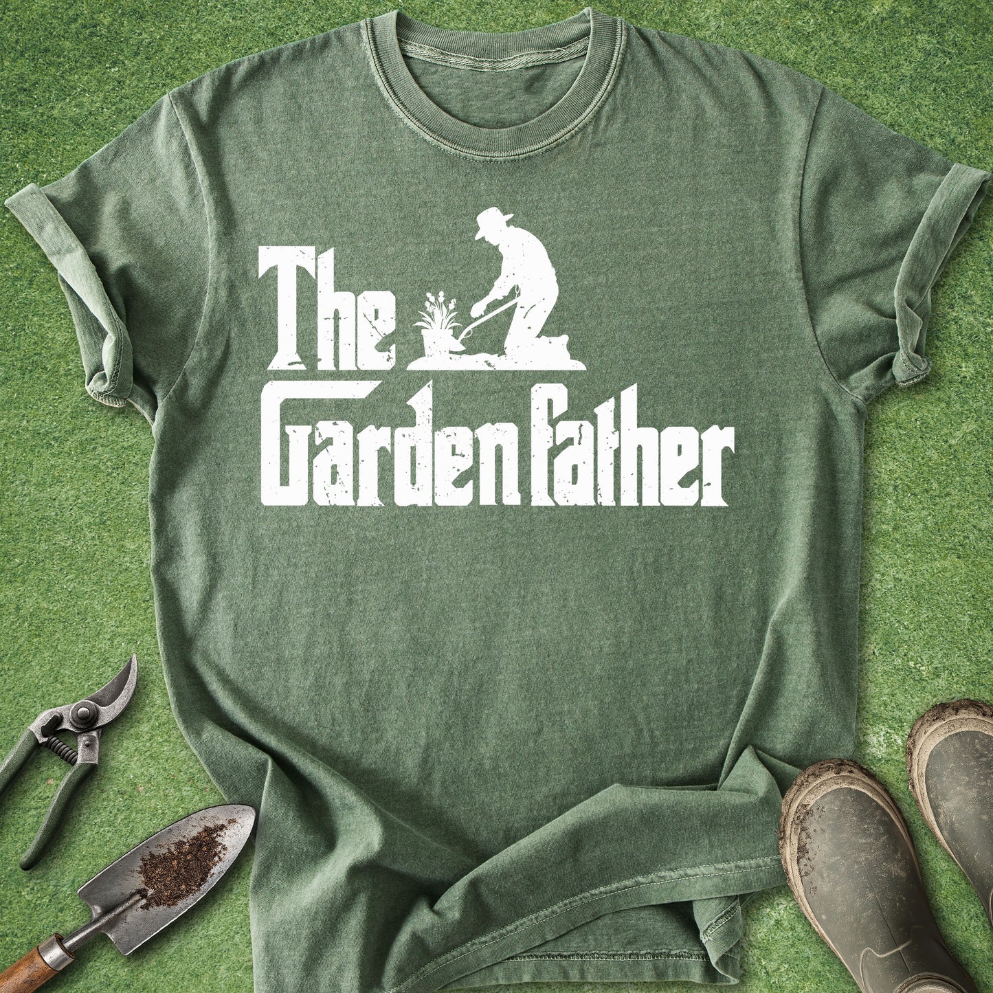 Green t-shirt with 'The Garden Father' design on a grass background