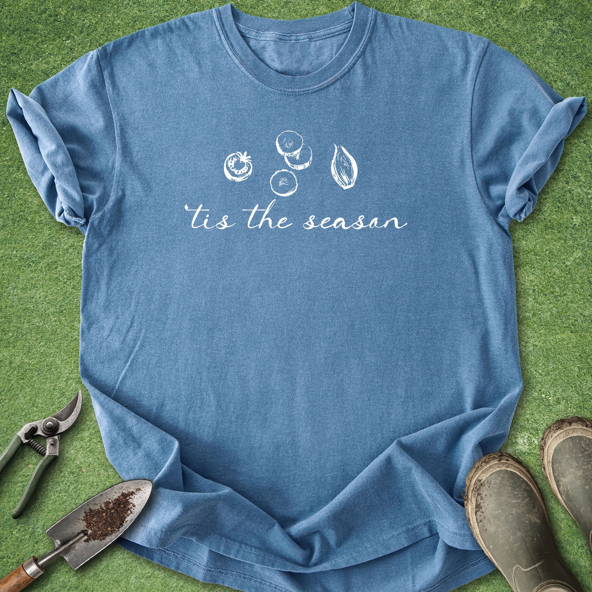 Blue t-shirt with 'tis the season' text and harvest graphics on a green background
