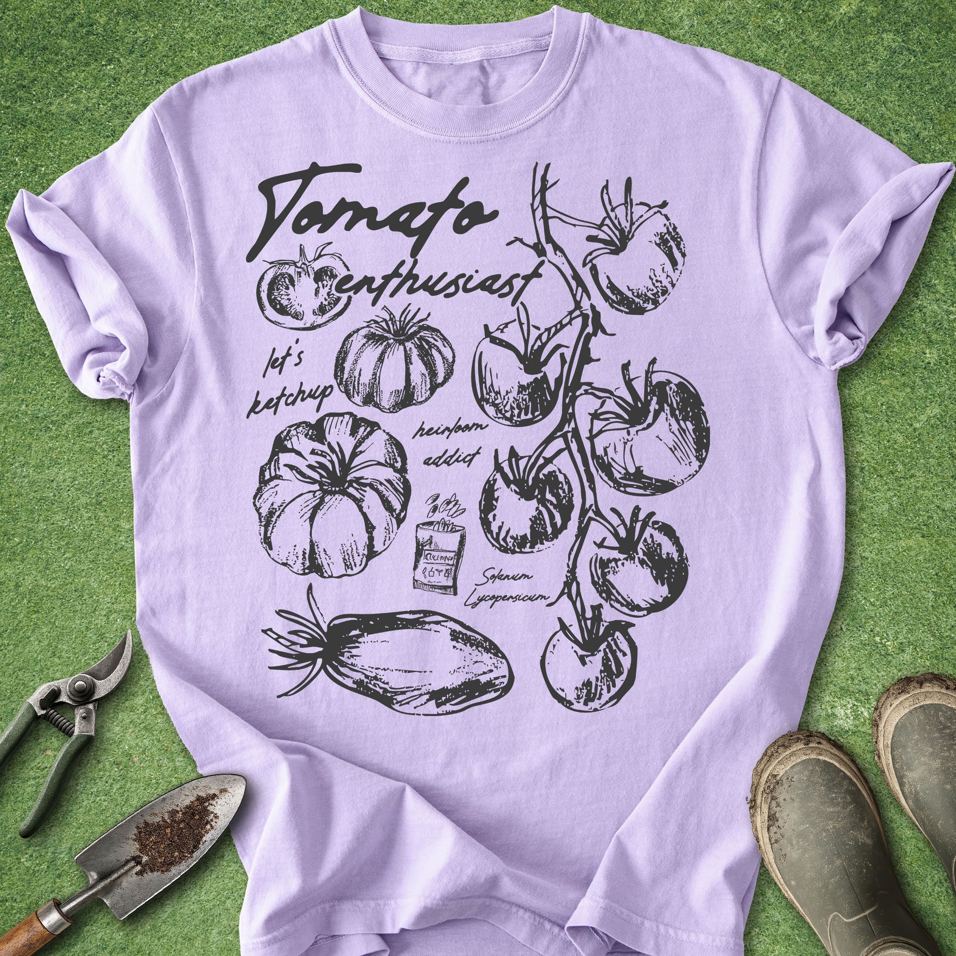 Lavender t-shirt with tomato graphic and text on a green background