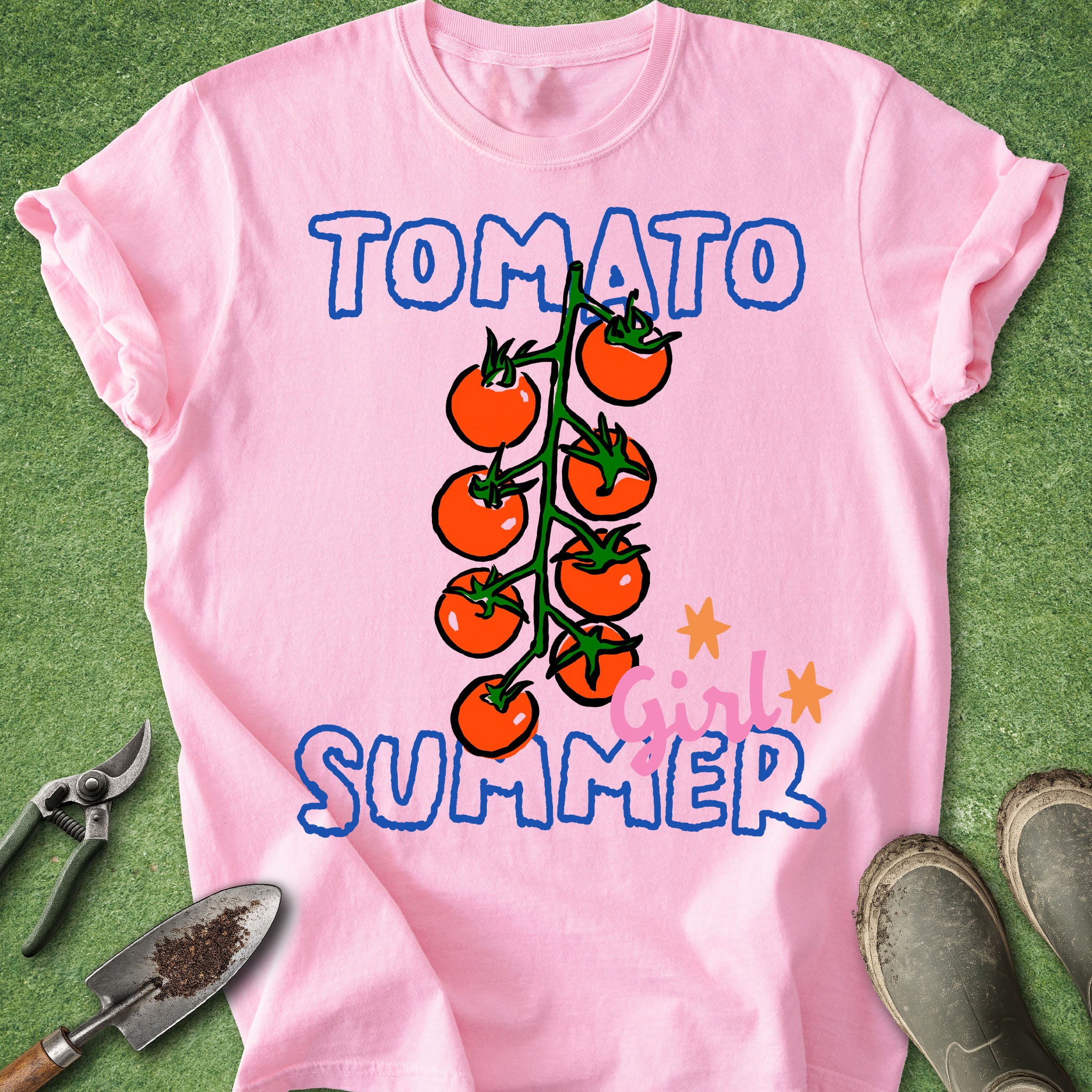 Pink t-shirt with tomato graphic and 'Tomato Girl Summer' text on a green background