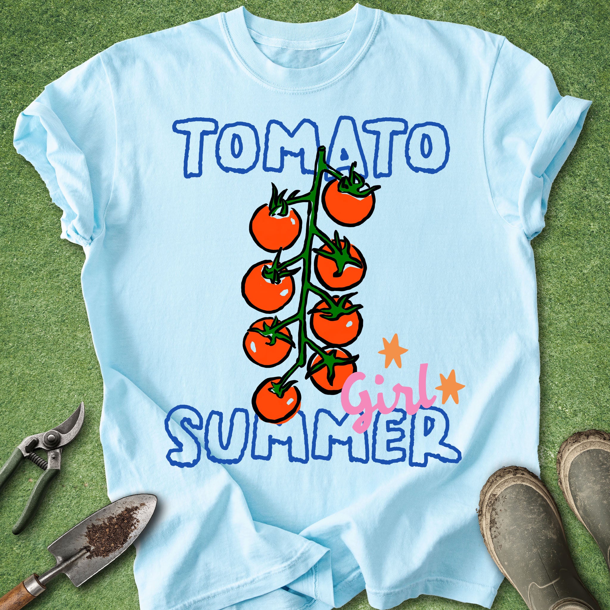 Light blue t-shirt with tomato graphic and 'Tomato Girl Summer' text on a grass background