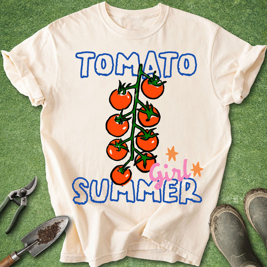 White t-shirt with 'Tomato Girl Summer' design on a green background