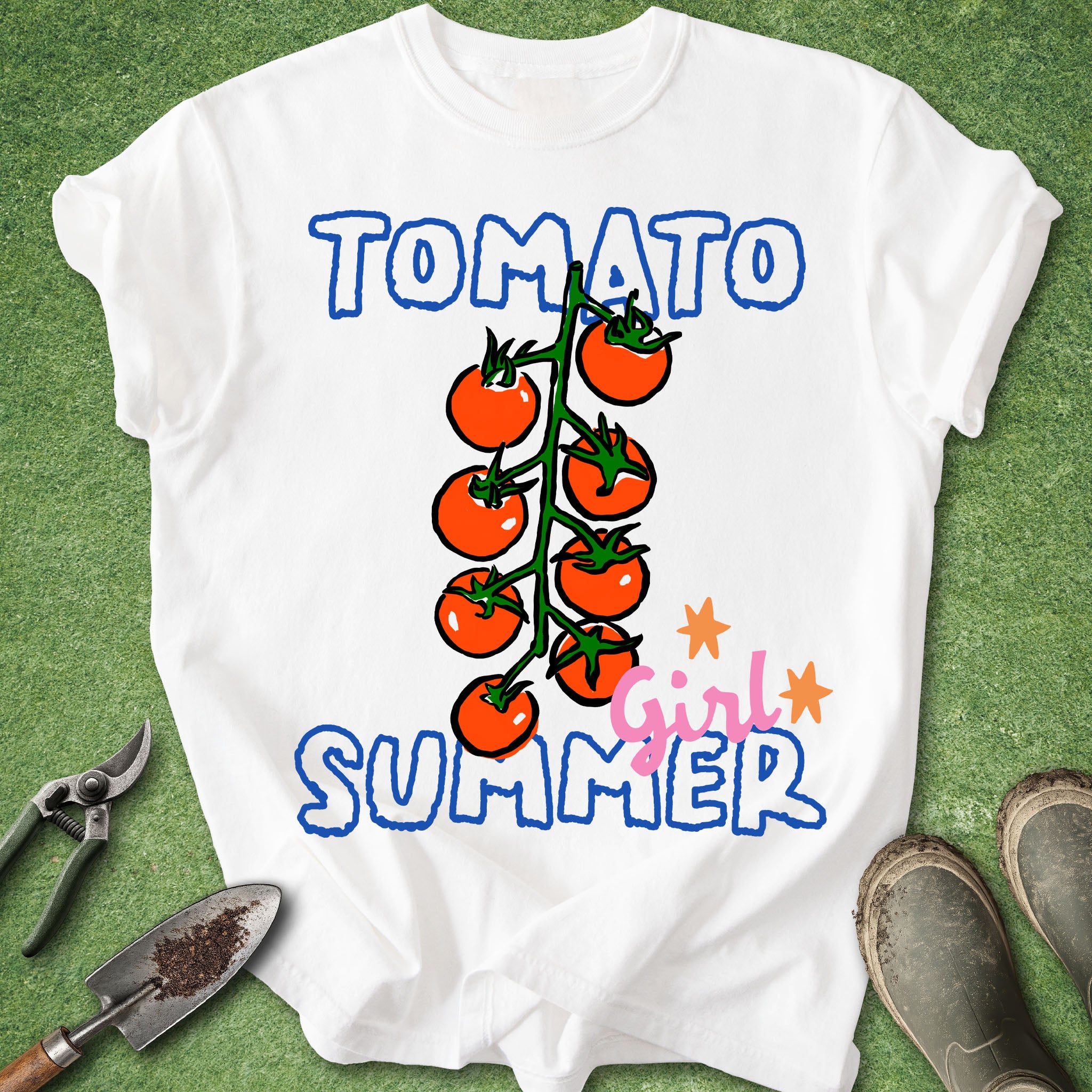White t-shirt with 'Tomato Girl Summer' design on a green background