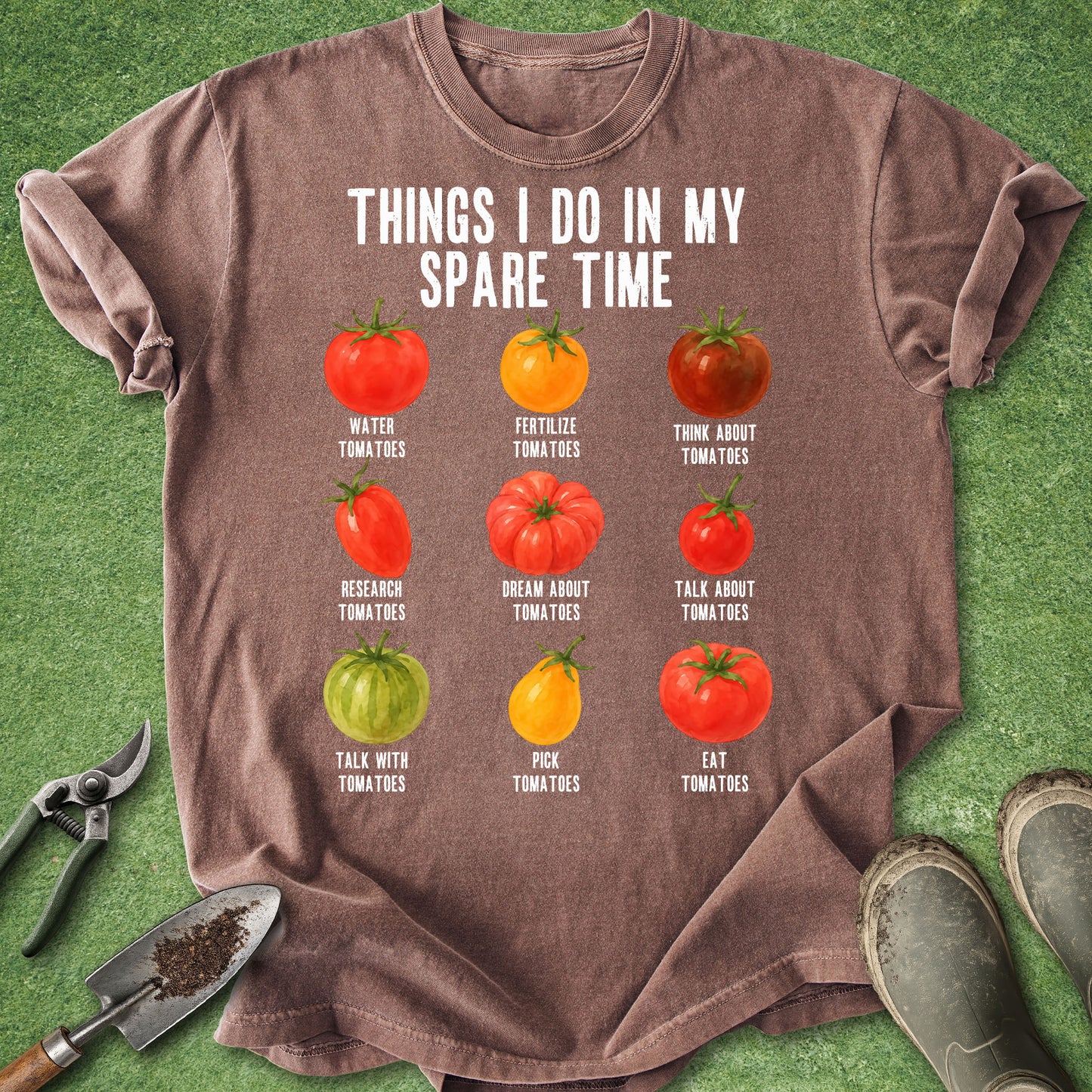 Espresso t-shirt featuring the phrase "Things I Do in My Spare Time" above nine illustrated tomatoes labeled with humorous gardening activities like watering, researching, picking, and eating tomatoes.