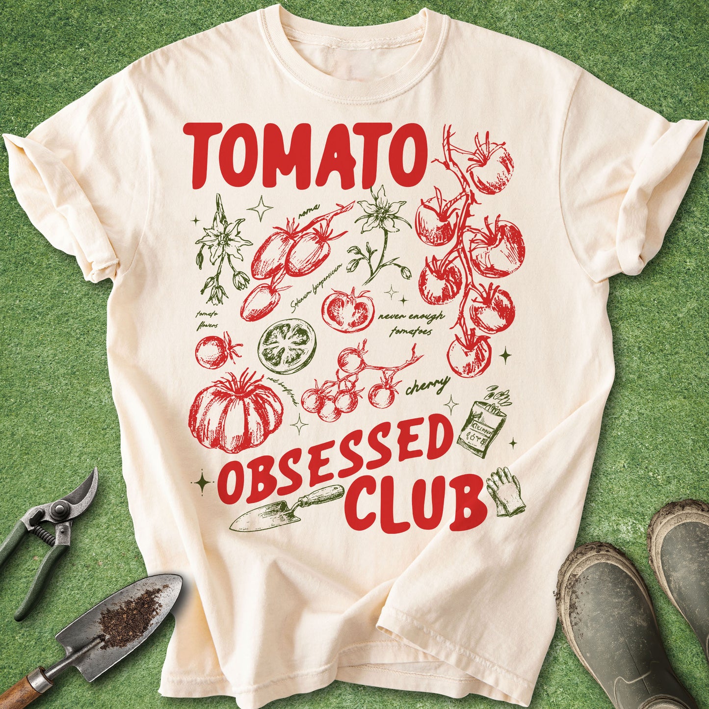 Ivory Comfort Colors t-shirt featuring a colorful Tomato Obsessed Club design with vintage-style tomato illustrations, tomato blossoms, cherry tomatoes, heirloom varieties, gardening tools, and garden-themed artwork.