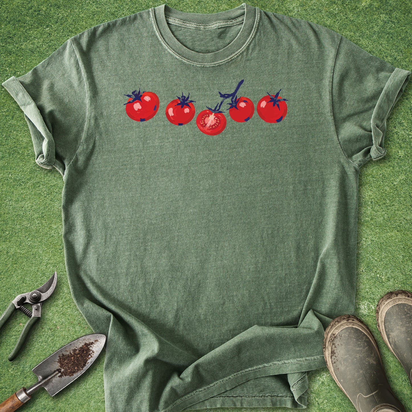 Moss Comfort Colors t-shirt featuring a minimalist row of hand-drawn red tomatoes with one sliced tomato illustration across the chest.