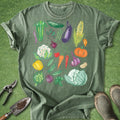 Green t-shirt with colorful vegetable illustrations on a green background