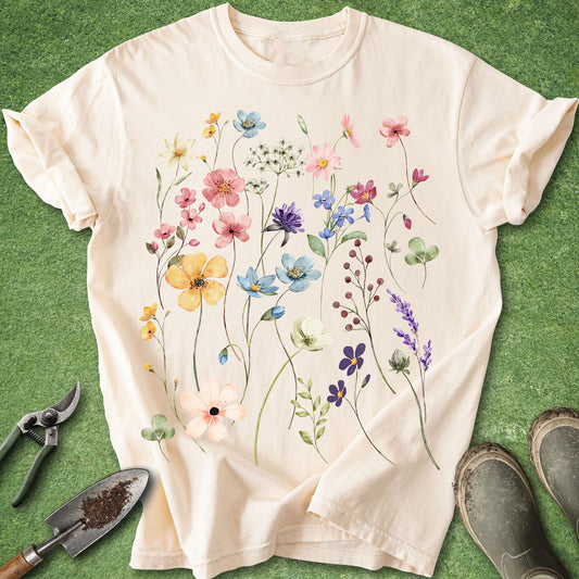 Beige t-shirt with floral design on a green background