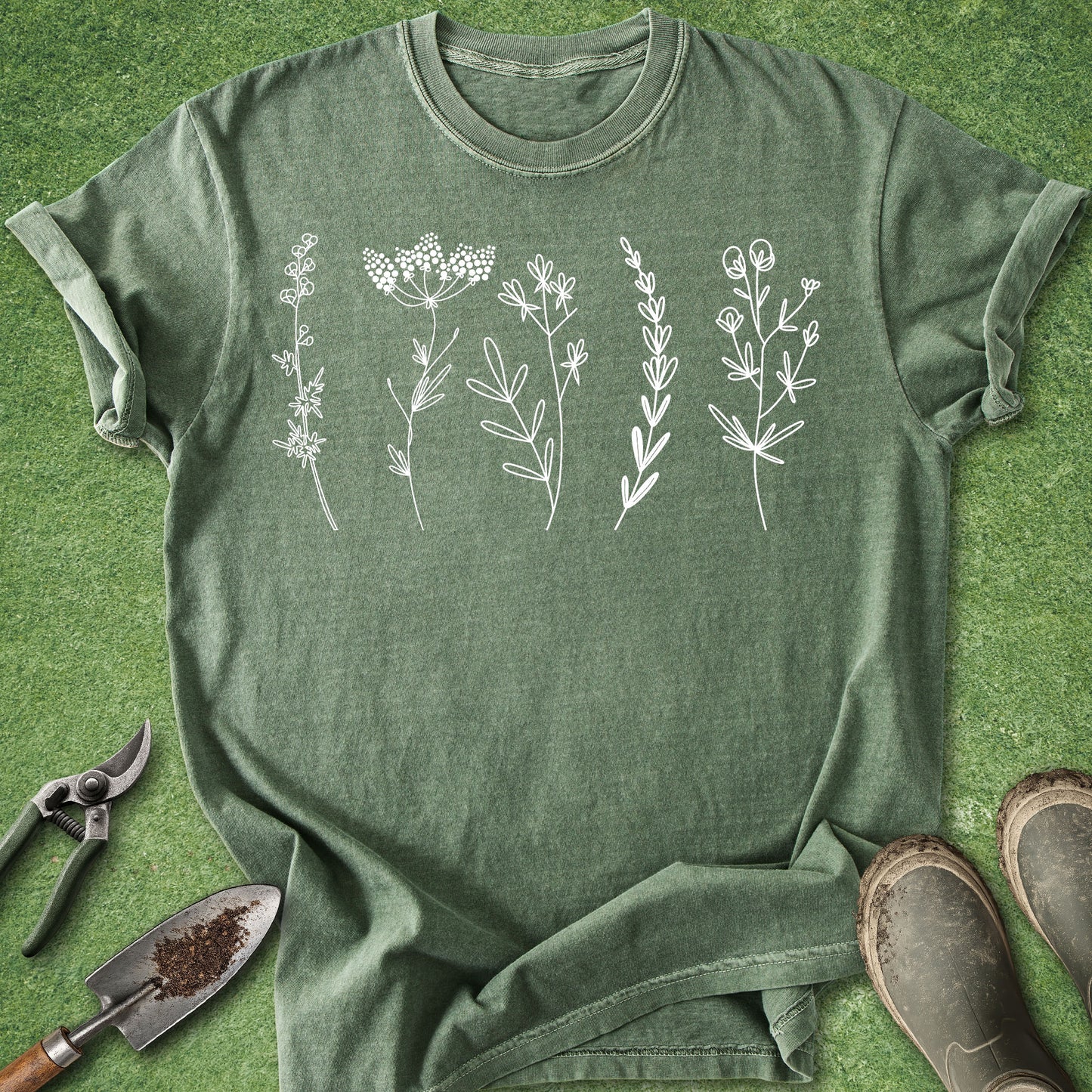 Green t-shirt with white floral designs on a green background