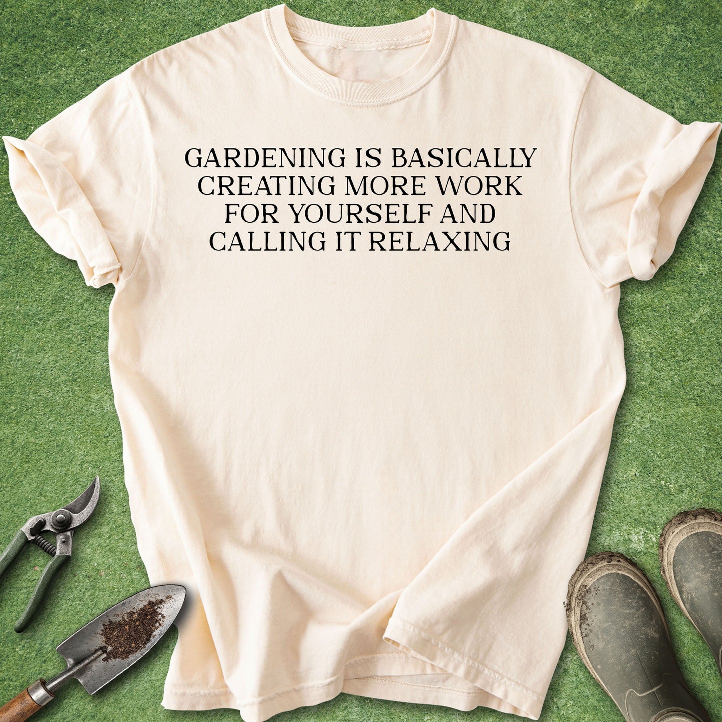 IVory colored t-shirt with the funny gardening quote “Gardening Is Basically Creating More Work for Yourself and Calling It Relaxing” in white text.