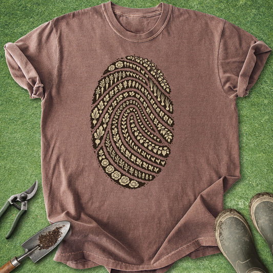 Garden fingerprint shirt featuring a large fingerprint made from rows of vegetables, herbs, seedlings and leafy garden plants.