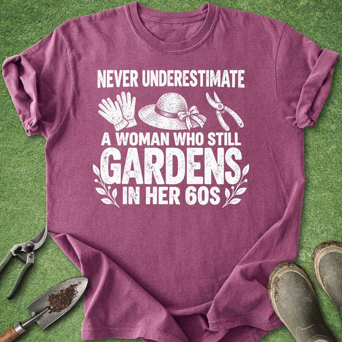 Berry gardening shirt with gloves, sun hat and pruning shears featuring the saying Never Underestimate a Woman Who Still Gardens in Her 60s.