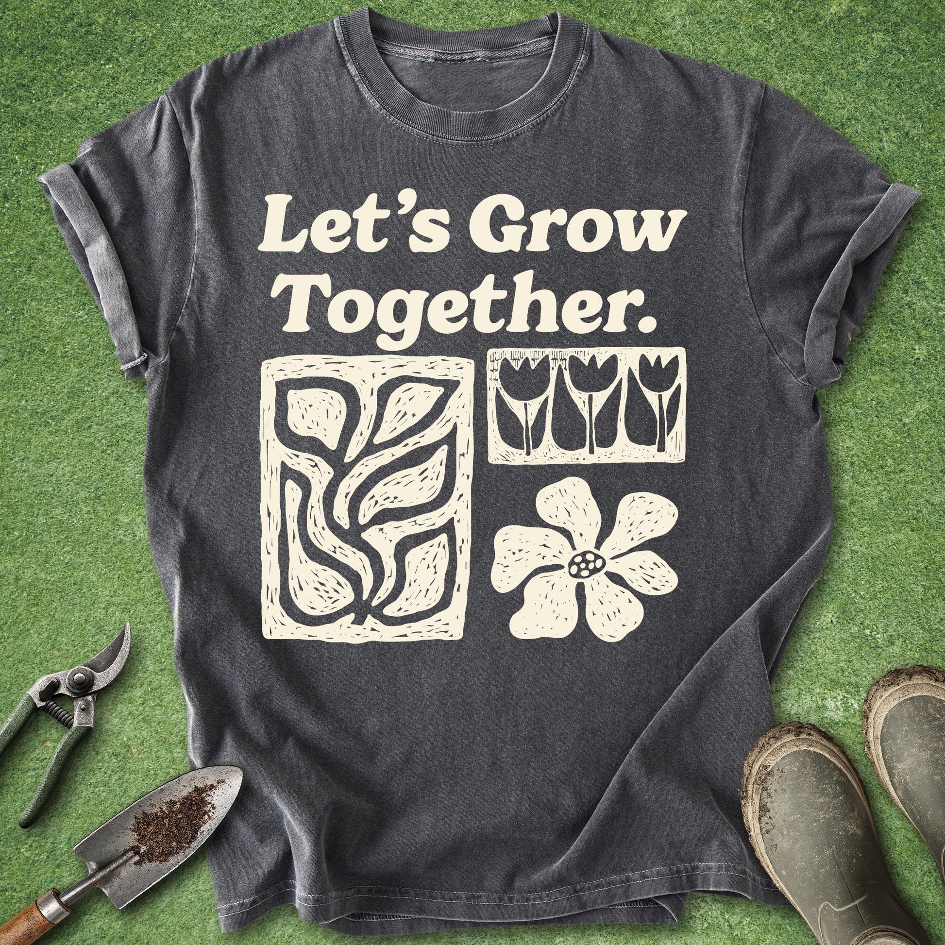 Dark gray gardening t-shirt with Let’s Grow Together text and cream folk-art illustrations of flowers, tulips and leafy plants.