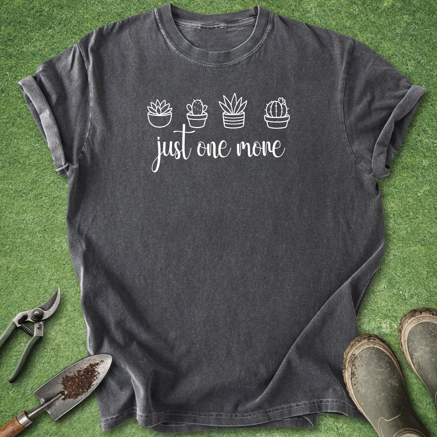 Gray t-shirt with cactus design and text on a green grass background