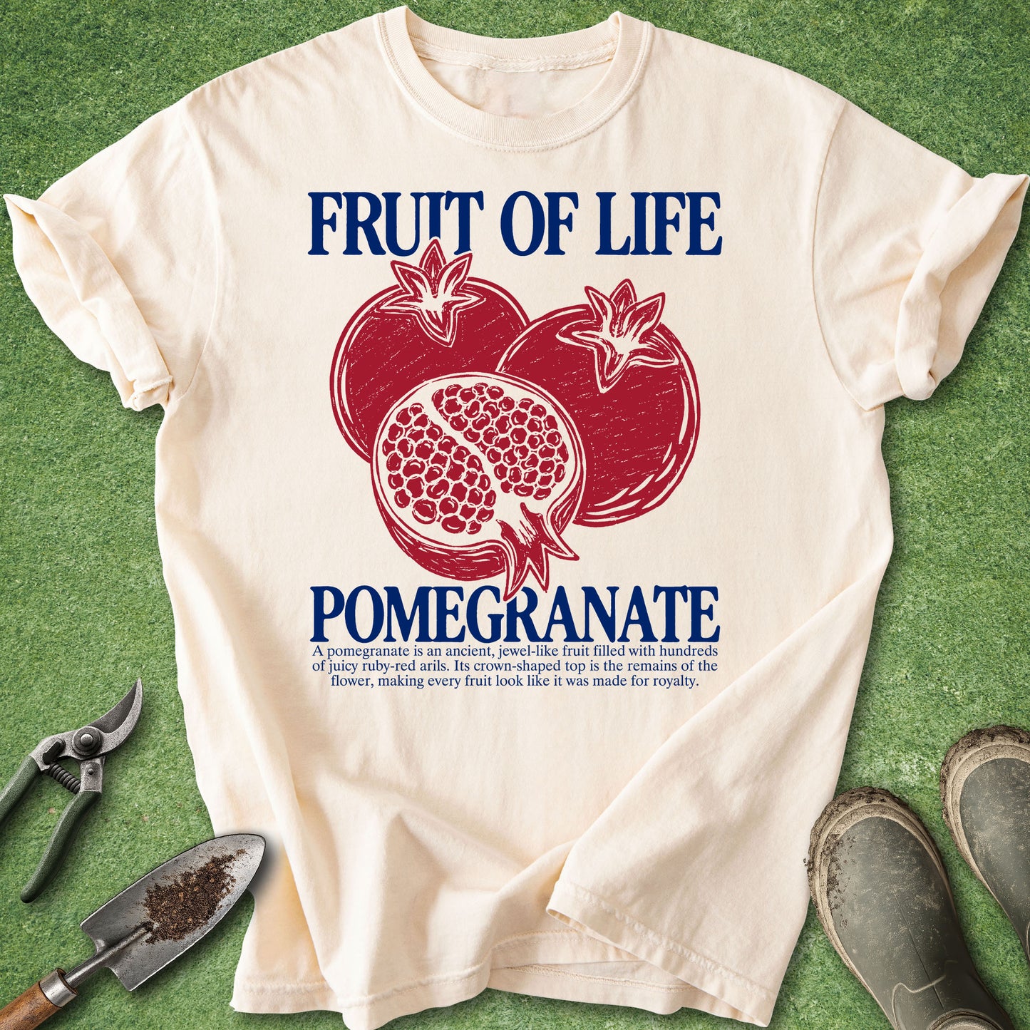 Ivory t-shirt with vintage red pomegranate illustration, Fruit of Life typography, sliced pomegranate and botanical description.