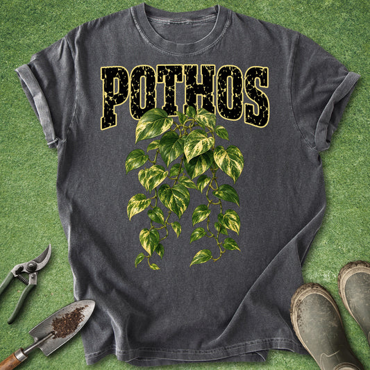 Dark gray t-shirt featuring a lush trailing golden pothos plant with green and yellow variegated leaves beneath bold Pothos lettering.