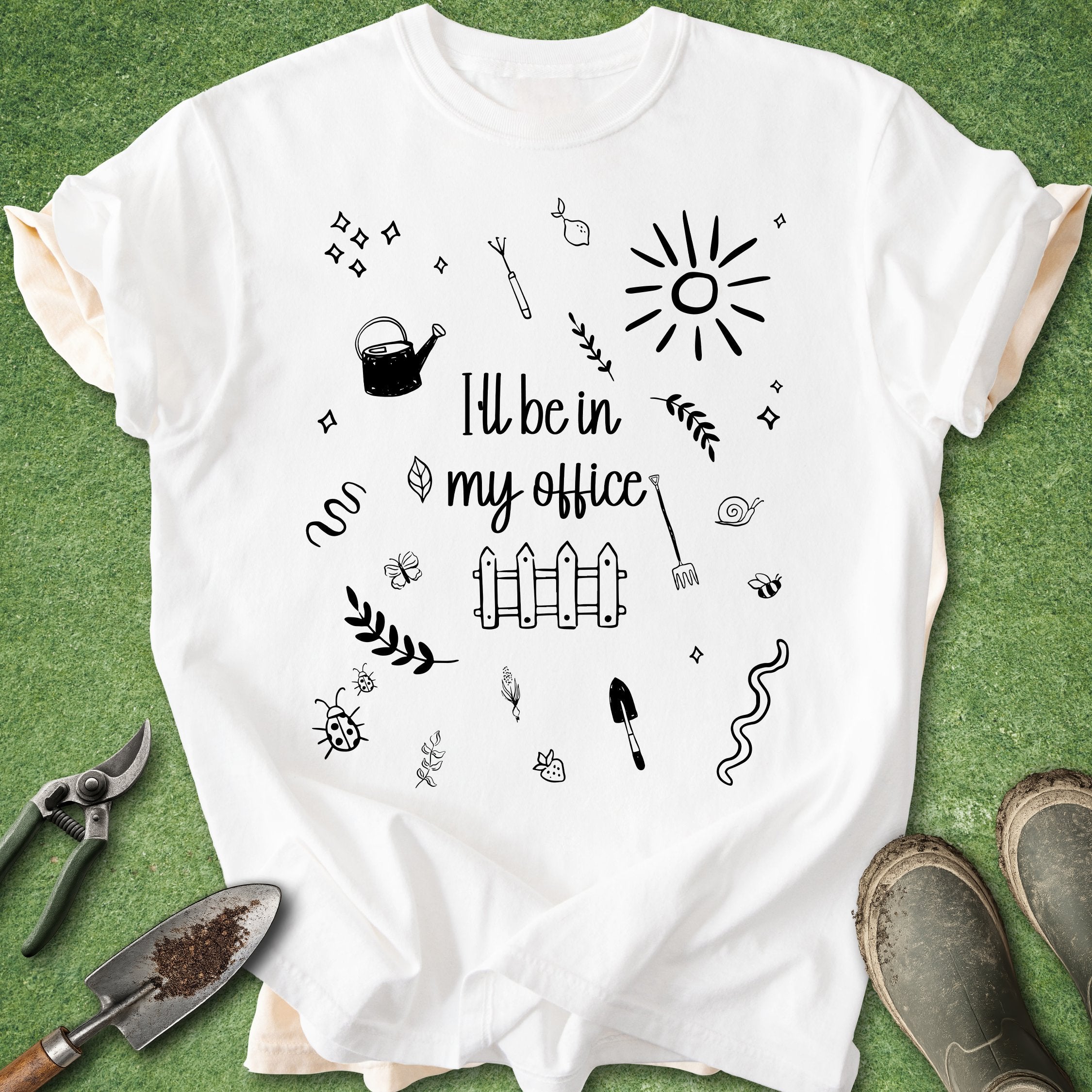 White t-shirt with black graphics and text on a green background