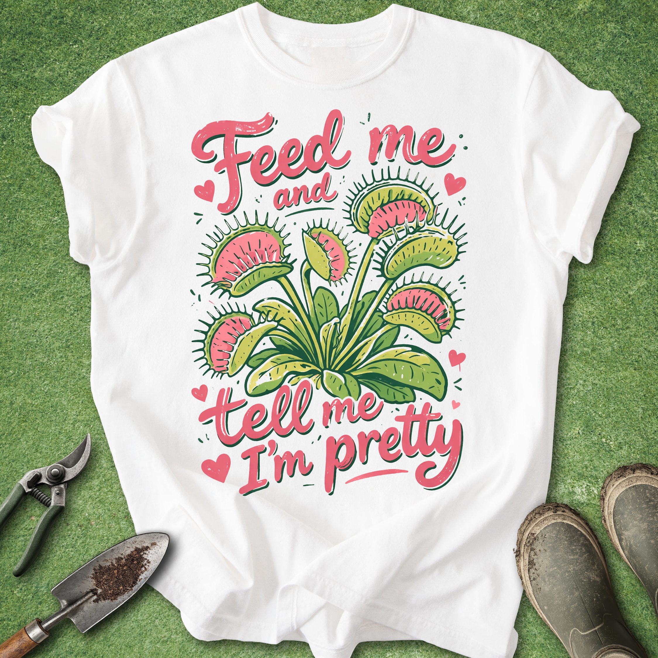 White t-shirt with Venus flytrap design and text on a green background