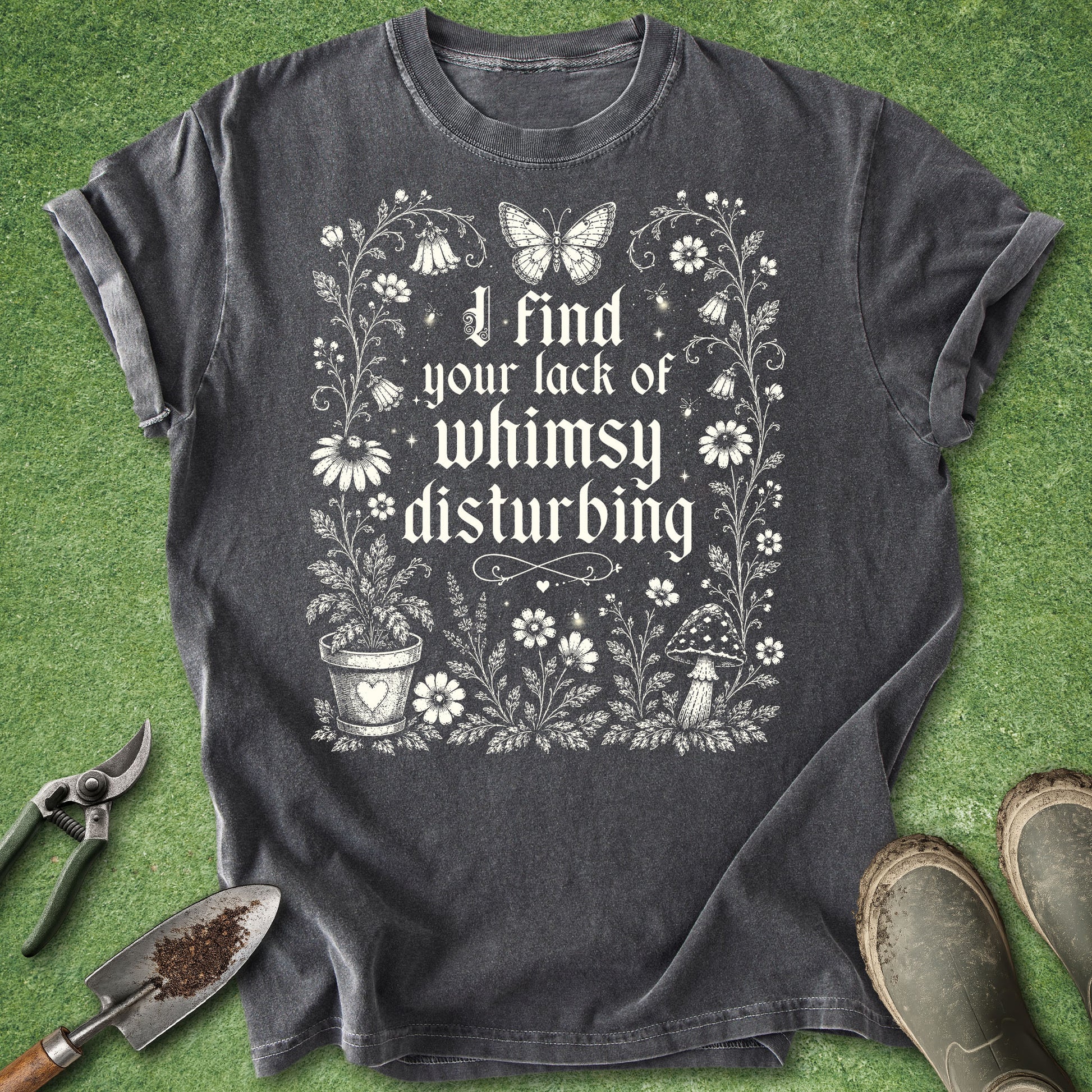Dark gray gardening t-shirt with I Find Your Lack of Whimsy Disturbing gothic text surrounded by wildflowers, butterfly, mushroom and botanical illustrations.